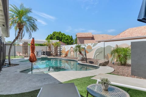 Outside wall with mural depicting the city of Gilbert by a local artist.