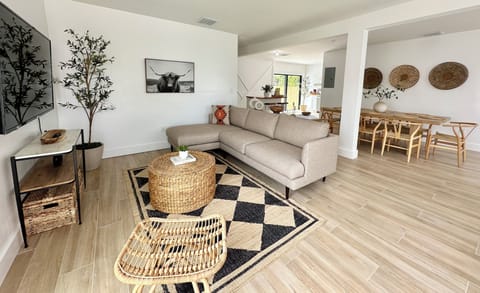 Living Room with a high end sectional and a 65” Smart TV