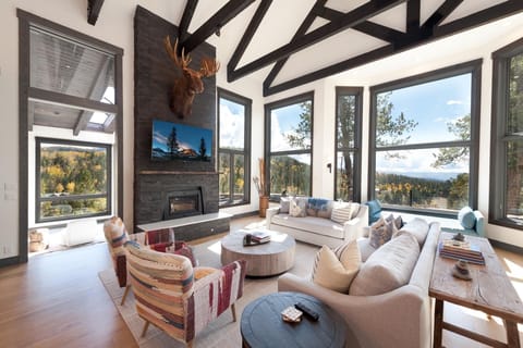 Main Living Space - TV, Wood Burning fireplace and amazing views from the floor to ceiling windows