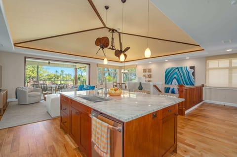 Large fully equipped kitchen, with island, dishwasher, refrigerator, wine cooler, oven, cooktop and microwave