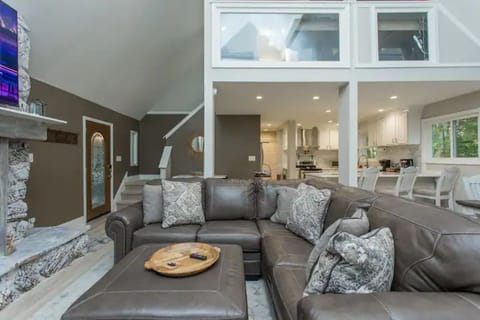 Open floor plan connects the living room, dining area, kitchen and game room