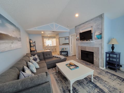 Living Room has large sectional and TV