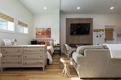 Studio with queen size bed, pull out couch, kitchen, laundry, fire pit, & grill.