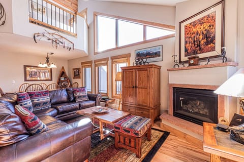 Comfortable living room with plush furniture and warm stove after a long day outside
