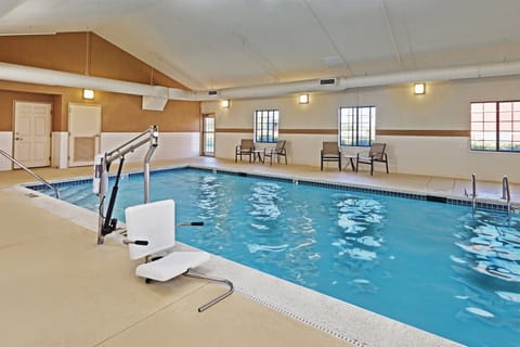 Take a refreshing dip in the indoor pool, surrounded by bright windows and comfortable seating.