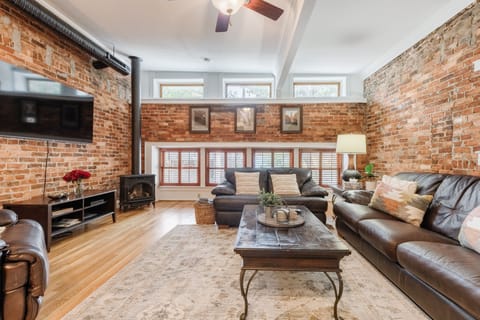 Welcome to Greenville's Trio Loft! The industrial-style living room is so open and inviting!