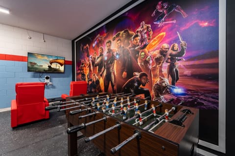 Themed games room showing wall mural and foosball table