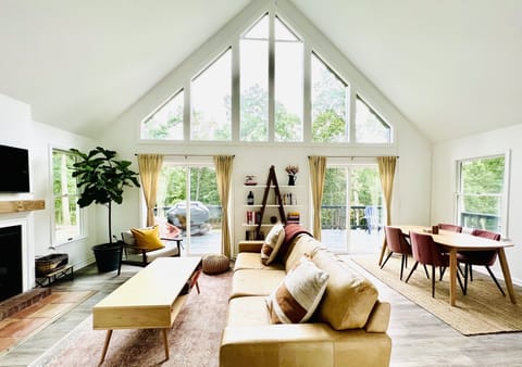 Living room & dining room with comfortable seating & lots of natural light.