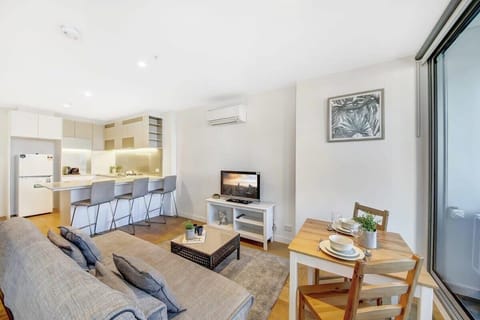 The living area with a 3-seater sofa bed.