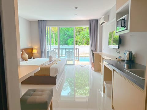 Deluxe Double Room, Pool Access | Individually furnished, desk, laptop workspace, soundproofing