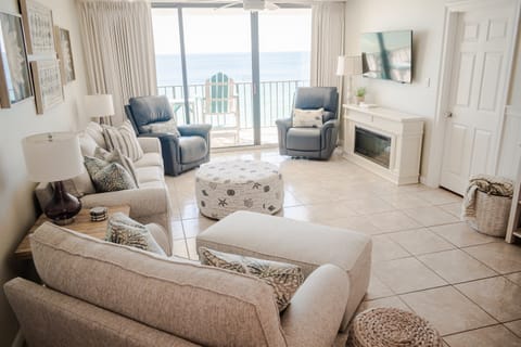 Settle back and relax on comfy living-room seating, including a recliner, and soak in the coastal vibe as you warm yourself by the electric fireplace.