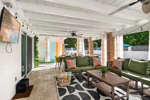 Outdoor Lounge: Vibrant patio with stylish seating, perfect for sunset hangouts and poolside fun!
