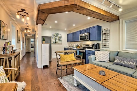 The bungalow’s open kitchen and living room make every moment together feel effortless — perfect for cozy meals, quiet evenings, and a little romance after exploring downtown Blue Ridge.