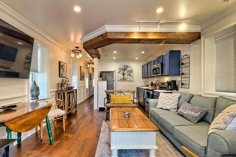 The living area feature ample lighting and is located just steps away from the kitchen