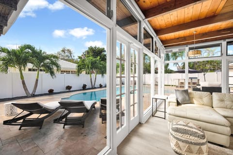 Floor to ceiling windows bring the interior and yard together in this bright, airy and open family home