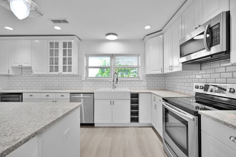 This modern kitchen is fully equipped with all utensils and crockery for your stay.