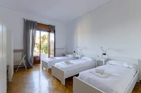 Apartment, 3 Bedrooms, Balcony, City View | 3 bedrooms, desk, laptop workspace, iron/ironing board