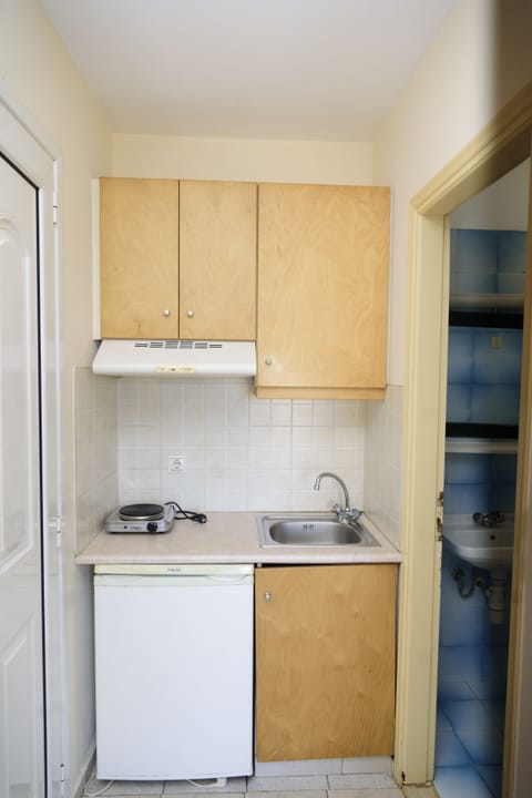 Mini-fridge, stovetop, toaster, dining tables