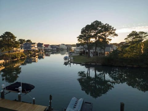 Unwind by the tranquil canal with a beautiful sunset view.