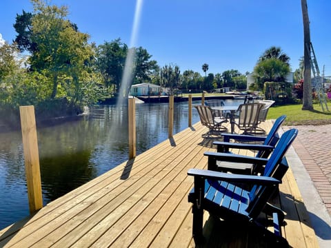 Out back on canal with new deck and floating dock. 