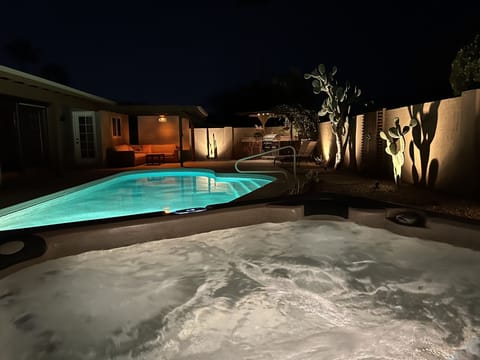 View from the hot tub towards the pool and patio