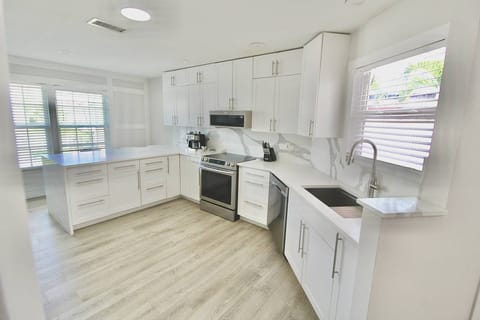 The spacious kitchen offers a beautiful space to prep, cook and dine together.
