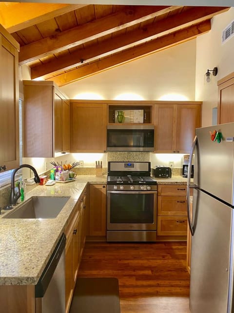 Kitchen is fully equipped with full sized stove, microwave, dishwasher, and refrigerator. Our home is your home, so feel free to cook your meals with a full array of pots and pans and a fully stocked spice cabinet. Plenty of plates and glassware