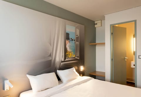 Premium bedding, desk, laptop workspace, blackout drapes