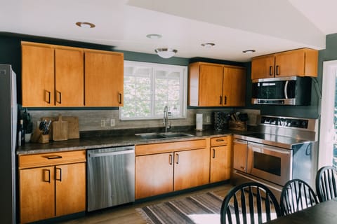The Skyhouse kitchen is fully stocked with modern appliances.
