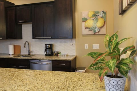 The kitchen is thoughtfully designed and furnished with state-of-the-art stainless steel appliances that combine functionality and style. From the sleek refrigerator to the elegant stove and oven, every appliance is at your disposal to make cooking a bree