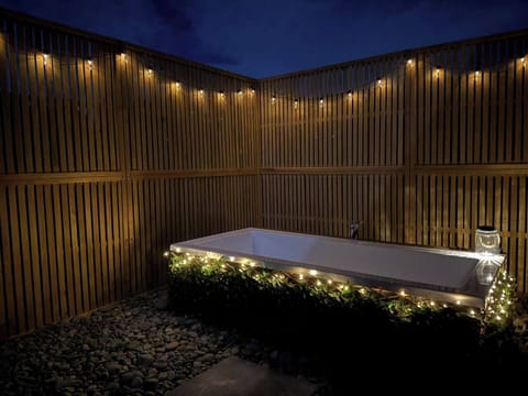 Private Outdoor bath with central tap and room for two.. 