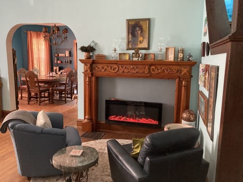 Living room with electric fireplace that plays music from your phone.