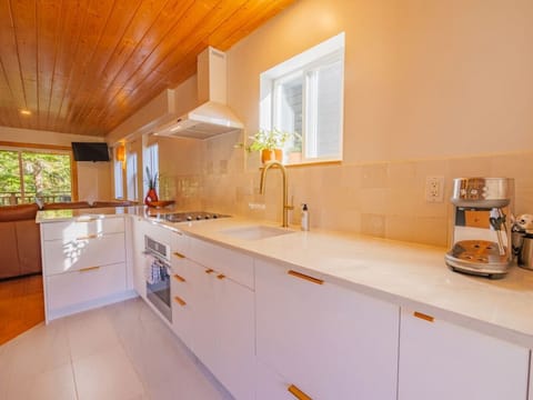 Stainless steel appliances and a white kitchen.