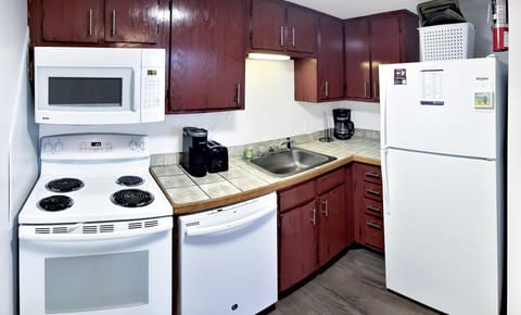 The kitchen is fully stocked with common items to make meals.