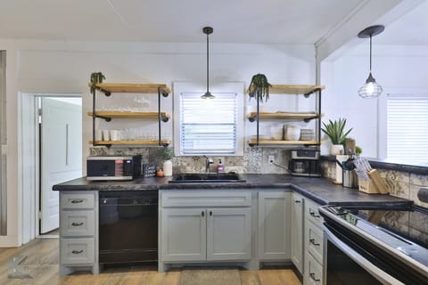 Full kitchen with restored cabinets. Stove, dishwasher, garbage disposal.