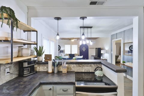 Fully stocked kitchen with free coffee, cooking kitchen amenities.