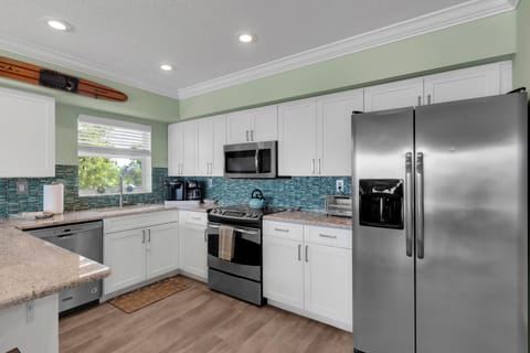 Keurig and drip coffee maker, dishwasher, and fridge with filtered ice/water.