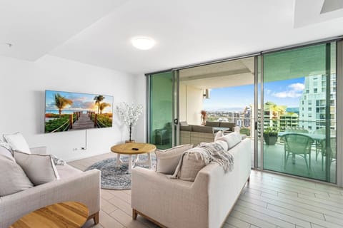 Step into the spacious living area, featuring two comfy sofas that convert into sofa beds, a Smart TV for entertainment, and complimentary Wi-Fi.