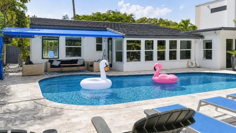 Private pool and covered patio with sun loungers and pool floats included.