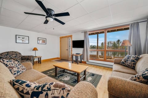 Relax in the comfort of your living room after a long day of outdoors fun with view of Spider Lake.