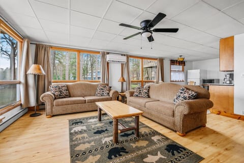 Living Room: Sun-soaked space with beautiful views, perfect for relaxation and family time!