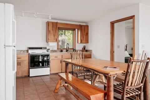 Kitchen: Modern design meets rustic charm—gather around the harvest table for delicious meals!