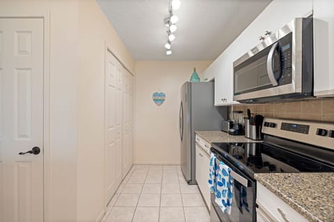 Fully Stocked Kitchen makes meal prep a breeze inside the condo.