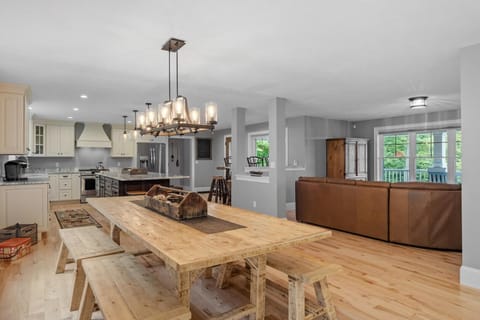 dining area overlooking living area and additional dining area