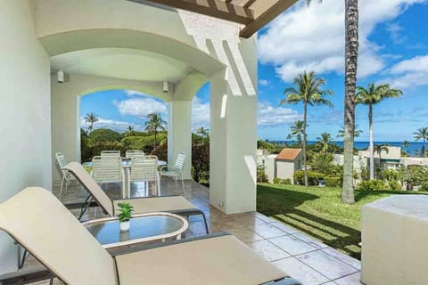 Relax on your private lanai with ocean breezes, tropical palms, and sweeping sea views stretching to the horizon—your perfect island escape.