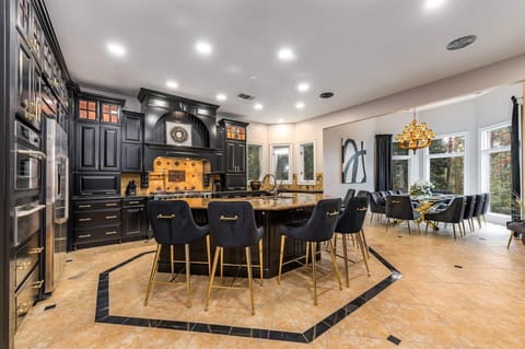 The large open kitchen invites the whole family to the table.