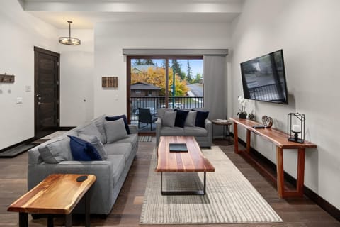 The grand room features an open concept living, dining, and kitchen area.