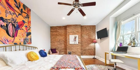 A king bed in the morning sun. But pull the curtains and sleep in if you`d like. (Third Floor South Bedroom)