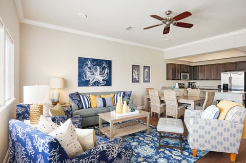 The colorful and modern coastal-themed living room.