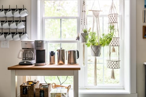 The coffee cart has a drip machine, Keurig, a French press, an electric kettle.